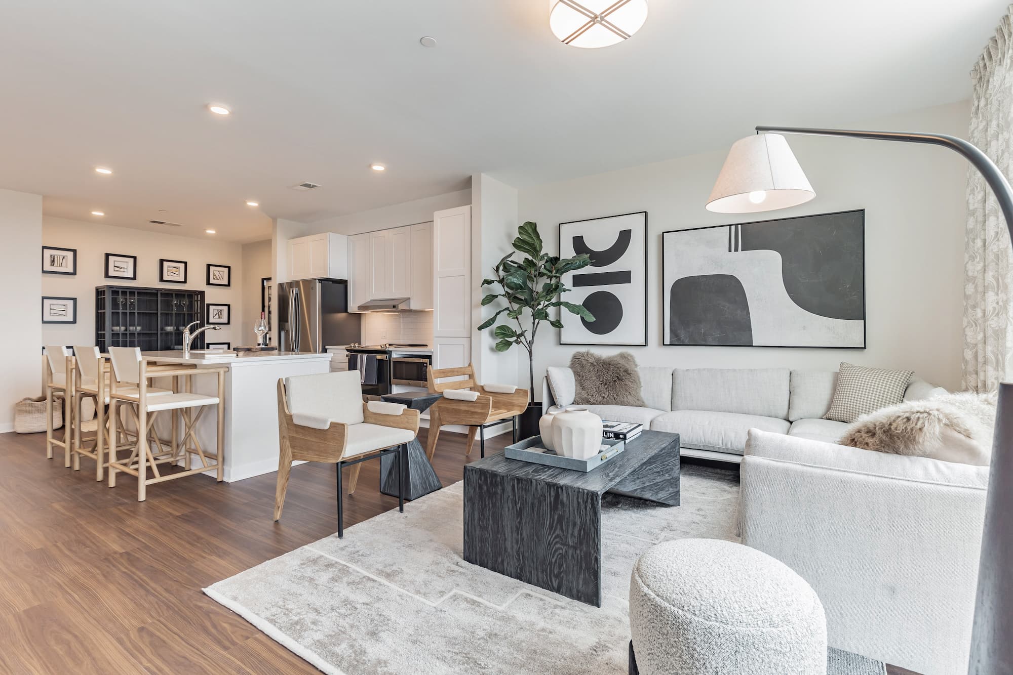 a photo of the interior of a fully decorated living room that is recently cleaned.