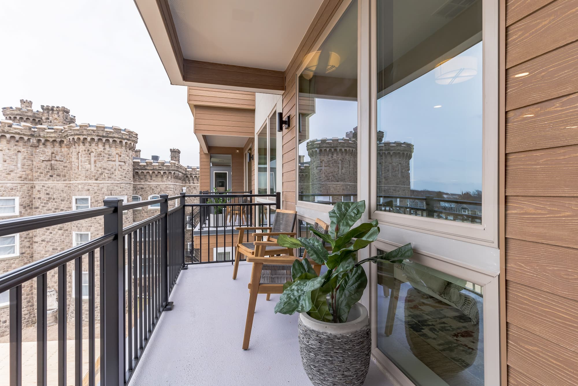 a photo of a nice clean patio with a castle in the background